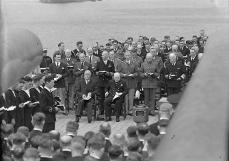 President Roosevelt and Prime Minister Churchill attend a Sunday service on the quarterdeck of HMS Prince of Wales during the Atlantic conference,  10 August 1941.