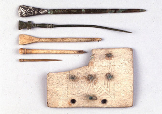 School tools: whale-bone writing-tablet and styluses from the middle Anglo-Saxon period