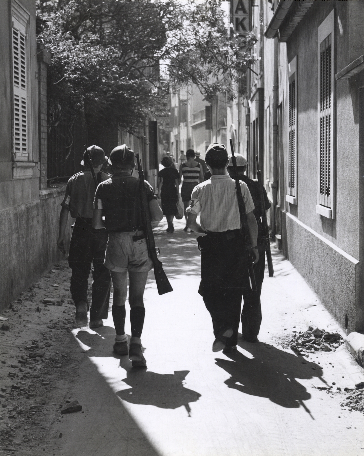 Four members of the Maquis in southern France, taken by a crew member of USS Cacotin, August 1944. US National Archives. Public Domain.