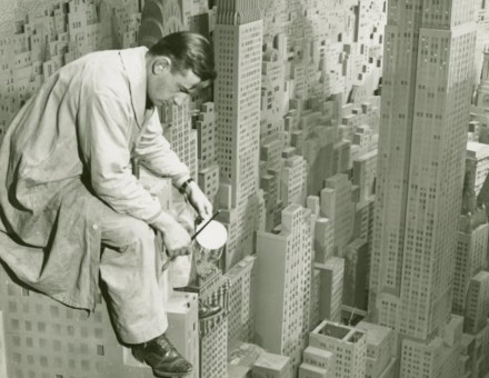 A painter at work on the 4,000-building Edison – City of Light diorama at the New York World’s Fair, 1940. New York Public Library. Public Domain.