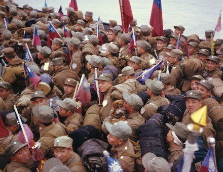 Chinese POWs headed for Taiwan, some of whom hold the flag of the Republic of China, the Nationalist government of Taiwan, 20 January 1954. Bettman/Getty Images.