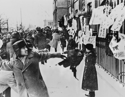 Students hurl rocks at the US embassy in Moscow to protest the Vietnam War whilst Soviet police look on. US Information Agency. Public Domain.