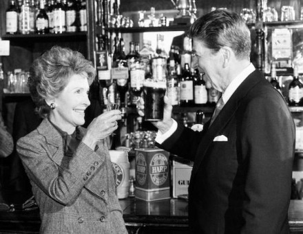 President Ronald Reagan and wife Nancy toast each other at the bar of O'Farrell's Pub in Ballyporeen, while on a four day visit to the Republic of Ireland, 3 June 1984. PA Images/Alamy Stock Photo.