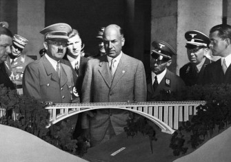 Hitler with Todt (centre) and Speer (far right) looking at the model  of a motorway viaduct,  3 October 1937.